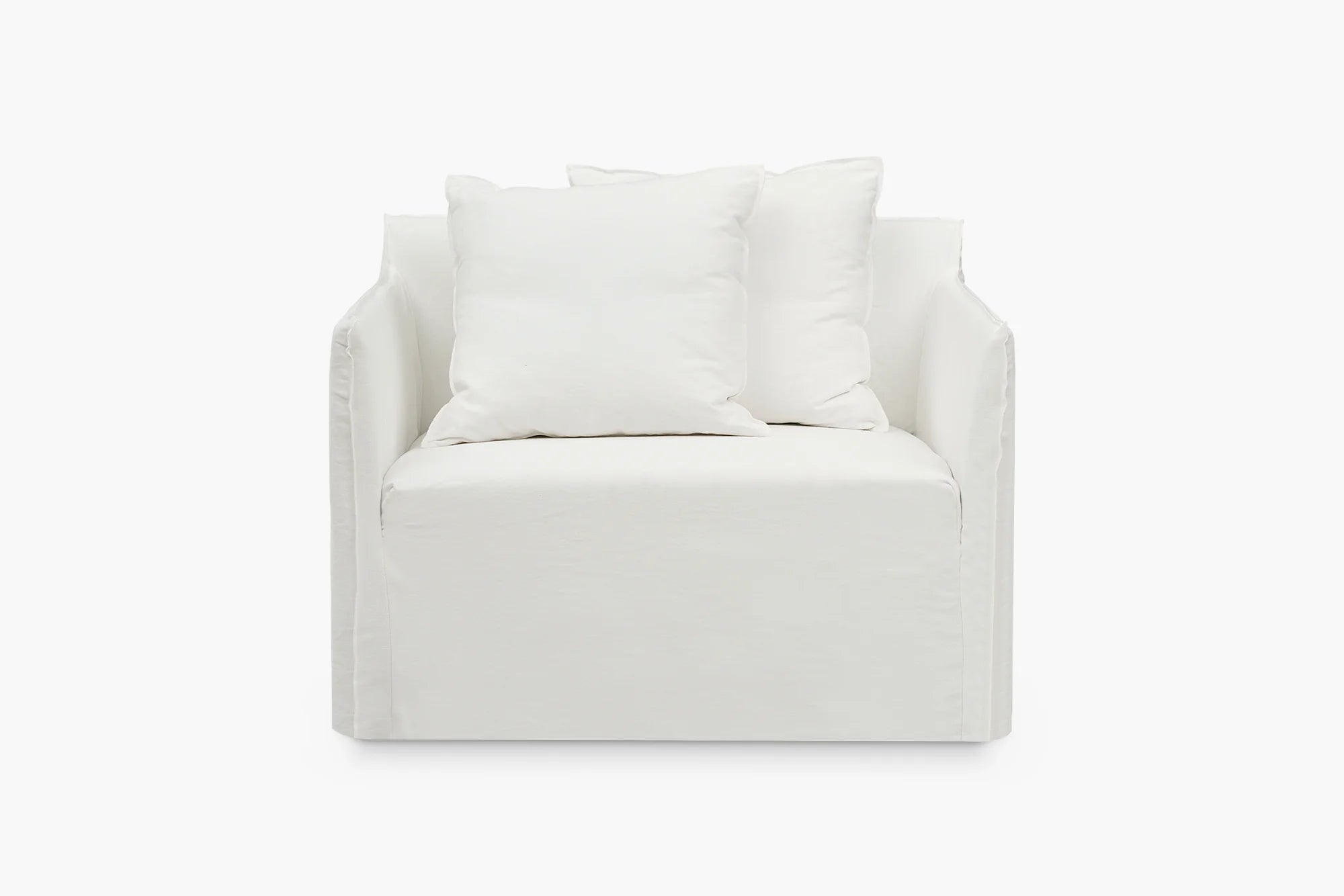 Joe loveseat in white loose cover with scatter cushions, angled view