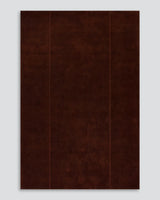 Bastion rug in claret, full view on grey