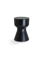 KO stool in black with a tapered hourglass shape