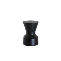 KO stool in black, angled view of the hourglass profile