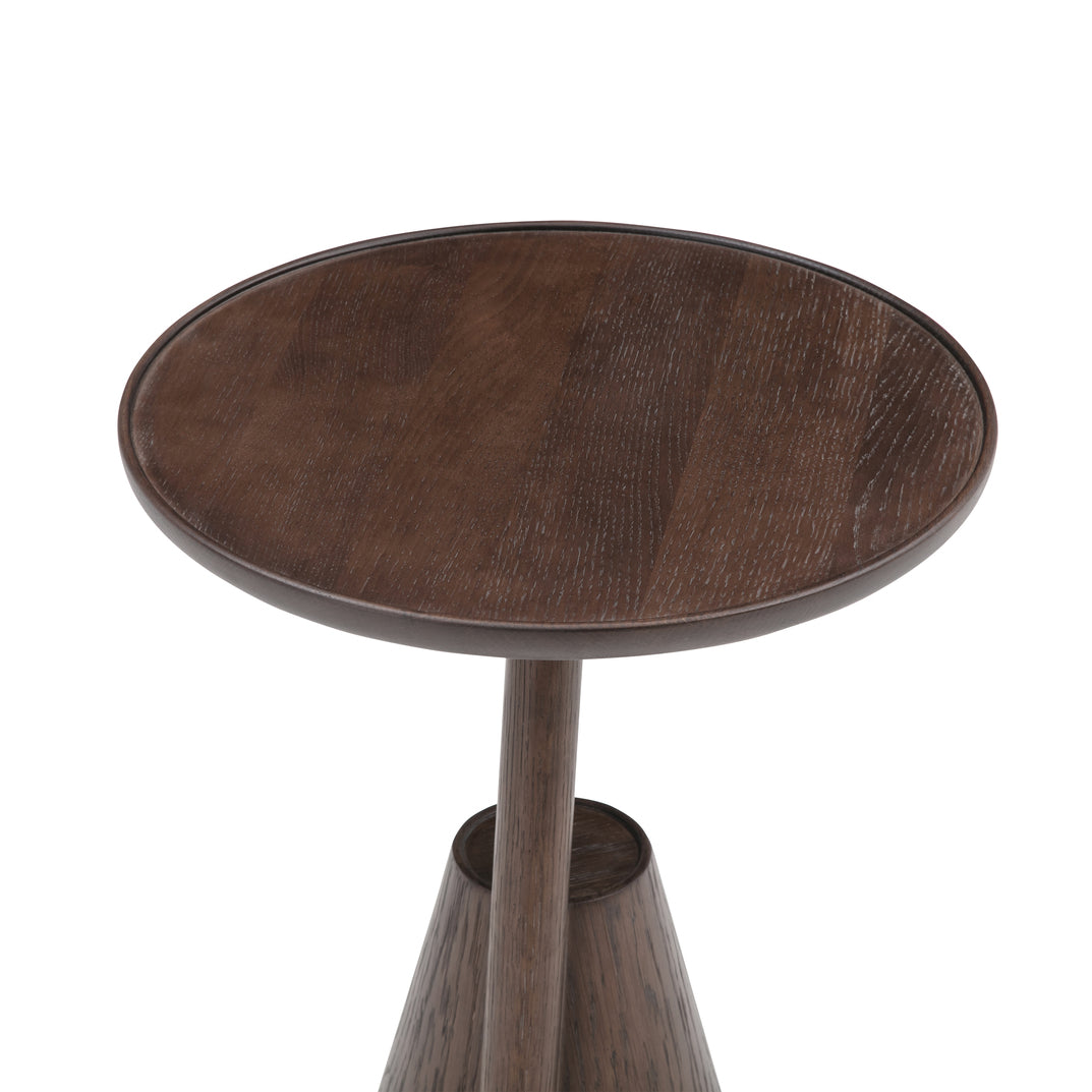 Close view of the Mate side table round top in brown-stained timber