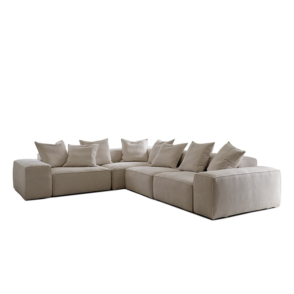 A beige 4 seat corner sofa with a modular design and multiple cushions.